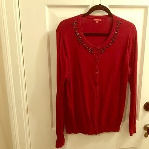 Red sweater with black embellishments